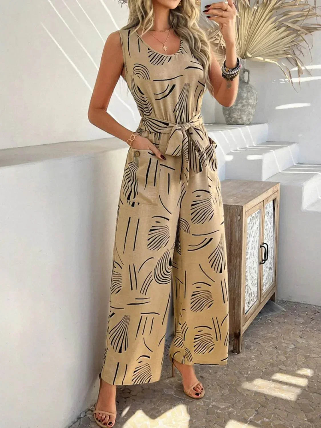 Printed Round Neck Sleeveless Tie Waist Jumpsuit - Velveta Studio