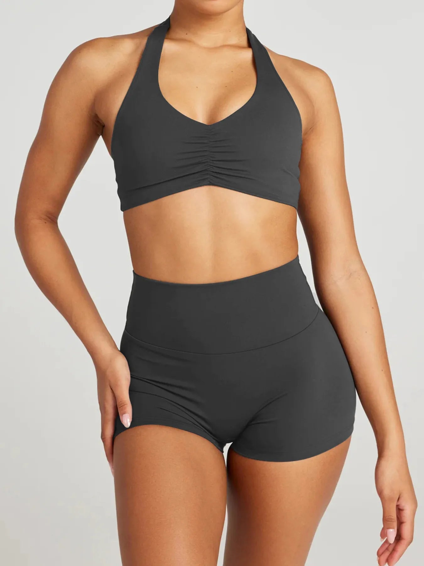 Model wearing halter neck cami and shorts lounge set