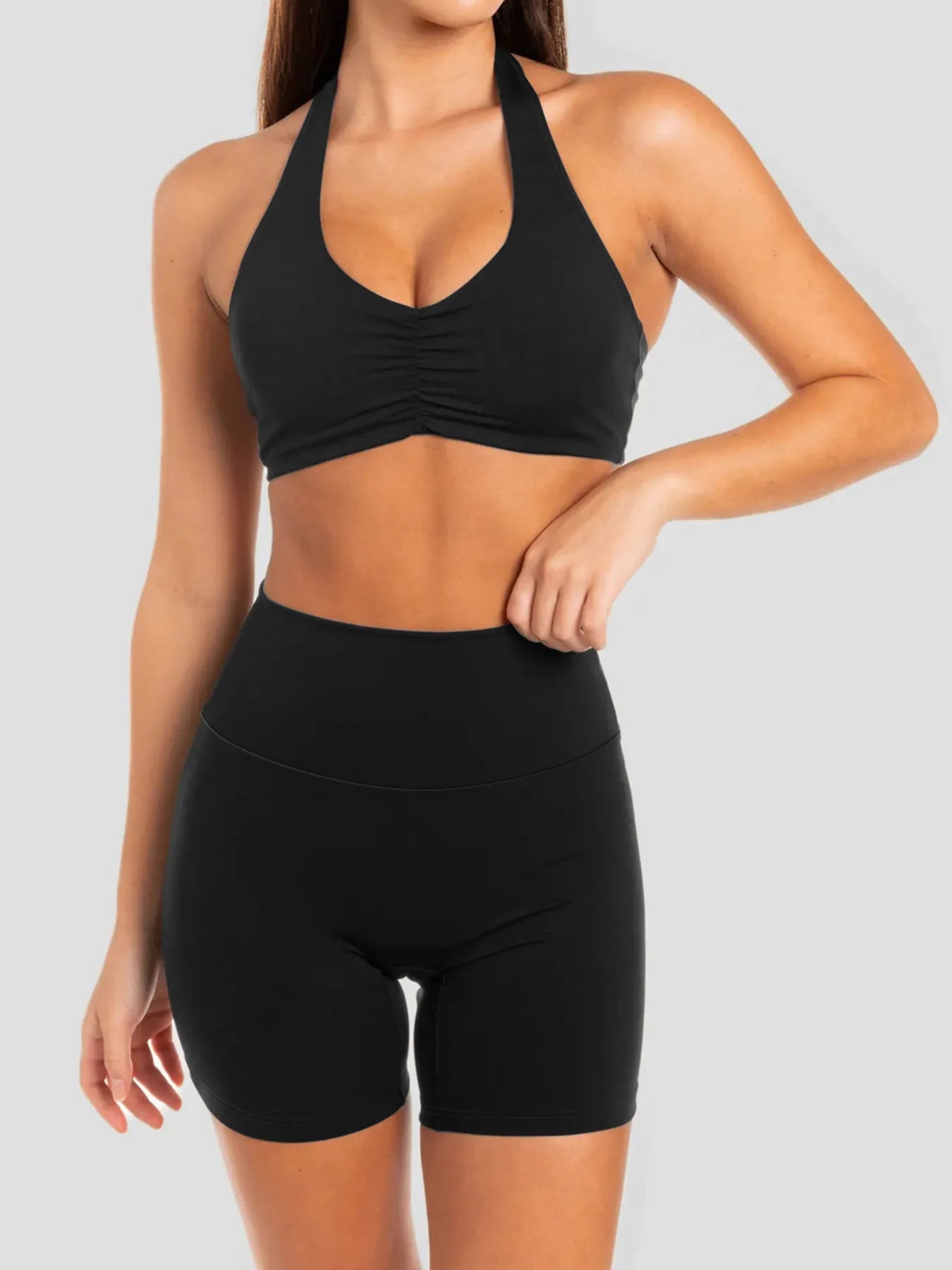 Model wearing halter neck cami and shorts lounge set