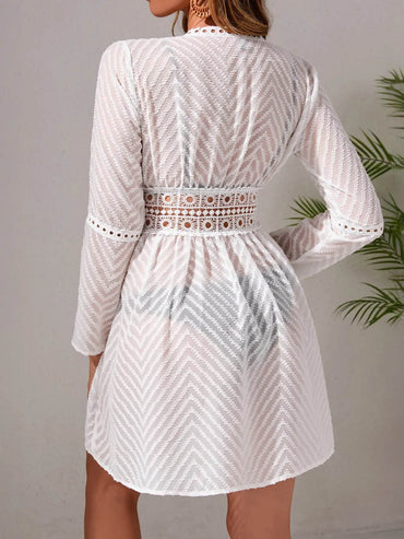 Back view of lightweight sheer lace-up top in mesh fabric